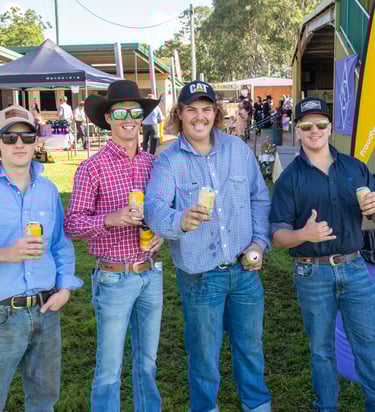 Four men enjoying the Nanango Races