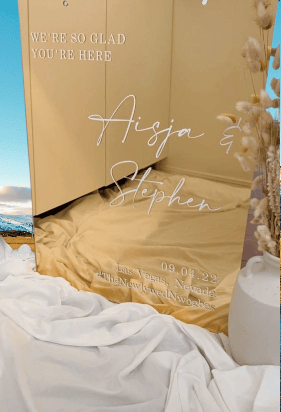 Elegant gold acrylic wedding sign with names Aisja & Stephen.