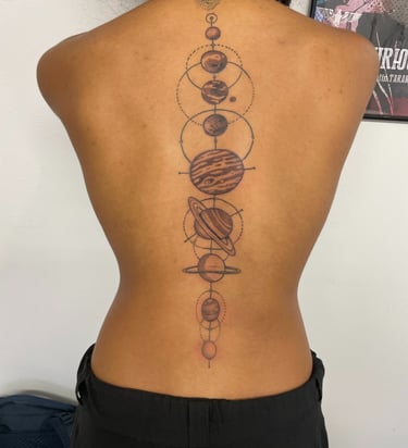 Planet system symetic tattoo on back