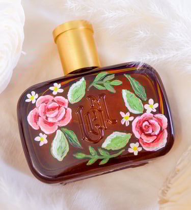 A perfume bottle painted with flowers by New York calligrapher and illustrator Handwritten by Belle.