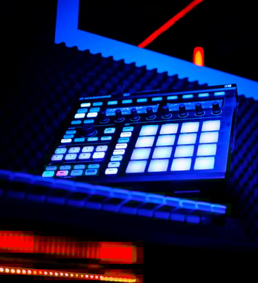 a dj controller controller and a keyboard in a recording studio