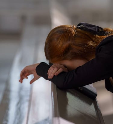 a woman with red hair praying in desperation
