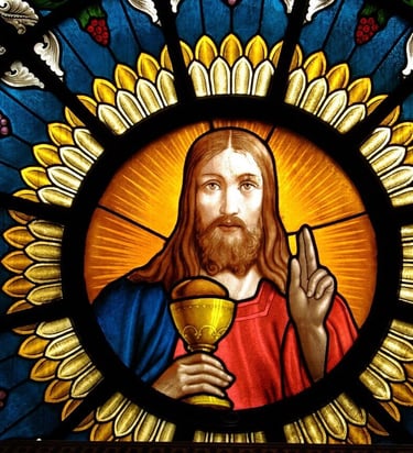 a stained glass window with a picture of jesus