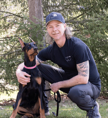 Professional Dog Trainer Guy Drinkwalter and his doberman Vixen