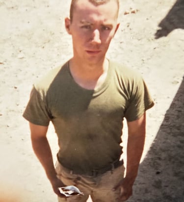 A fatigued Marine in Iraq, 2003, after months of intense combat deployment. The visible weight loss 