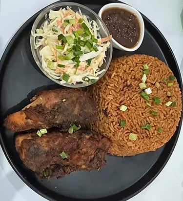 Jollof Rice, chicken, salad, and Shito