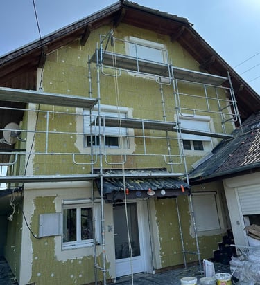 a house with a scafaffe on a scaffolded up to