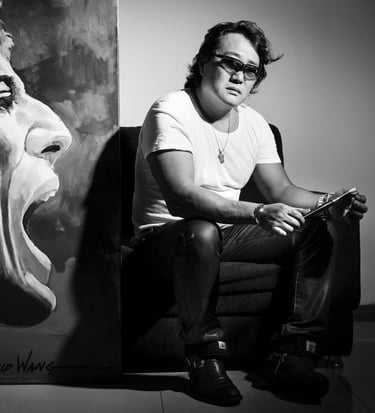 a man sitting in a chair with a skateboard