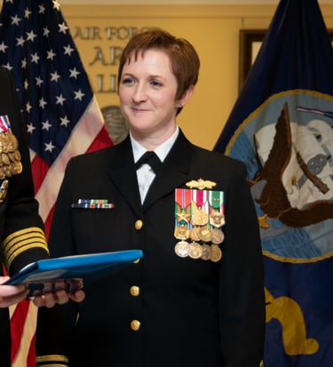 Commander Tetatzin receives the Meritorious Service Medal at her retirement ceremony in the Pentagon