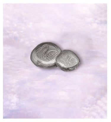 Handcrafted pure silver nugget with a crane logo in smooth finish