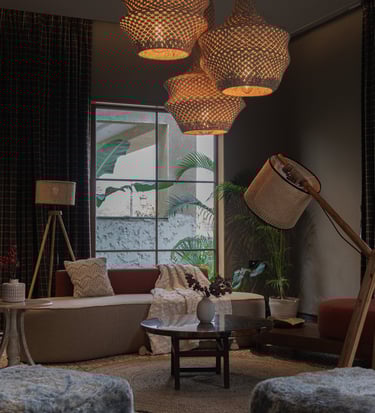 a living room with a couch and chairs