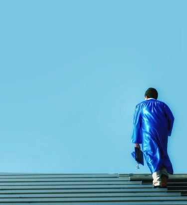 a man in a blue suit walking up stairs