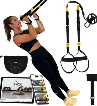 A woman using a TRX suspension trainer kit with a door anchor and mobile workout app for home fitness.