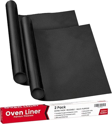 Two black reusable non-stick oven liners next to their premium thickness retail packaging box.