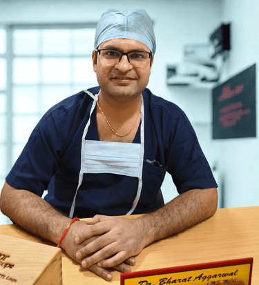 "Dr Bharat Agarwal consulting patient at plastic, reconstructive and cosmetic surgery clinic in Udaipur"