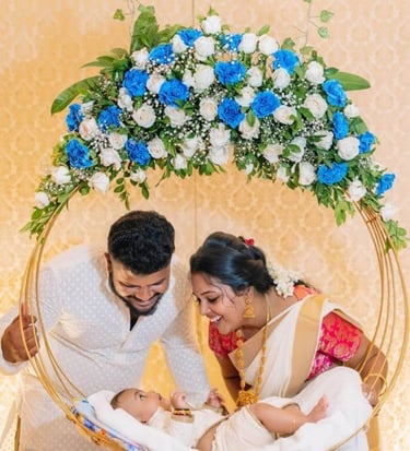 a man and woman in a basket with flowers