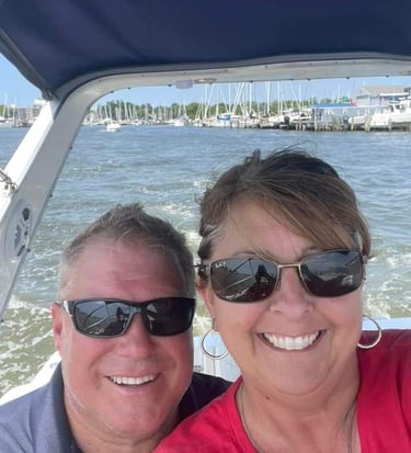 Chesapeake Captain Services LLC owner Tom Bachur & wife Kelly aboard their boat "Discapio"