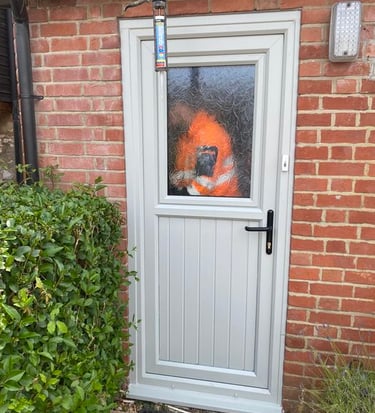 general buildds worker fixing a white door in worcester