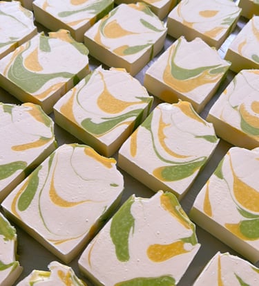 a table with a bunch of shea butter soap bars