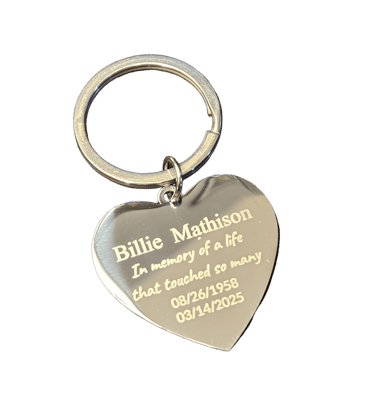 a heart shaped keychain with memorial