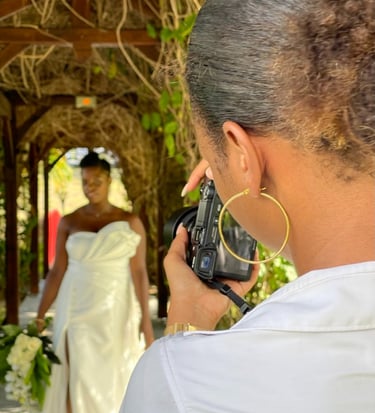 a woman in a wedding dress is taking a picture of a bride