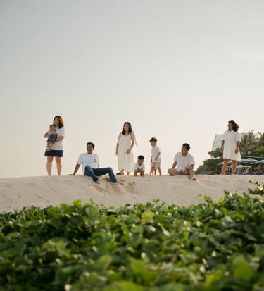 Children exploring the coastline during a family photography session at The Apurva Kempinski Nusa Dua Bali