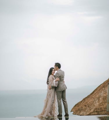 Romantic prewedding couple by cliffside ocean view at Amankila Karangasem Bali
