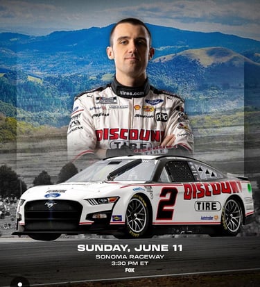 Austin Cindric, Discount Tire Nascar driver, posing in a photoshoot with his racecar