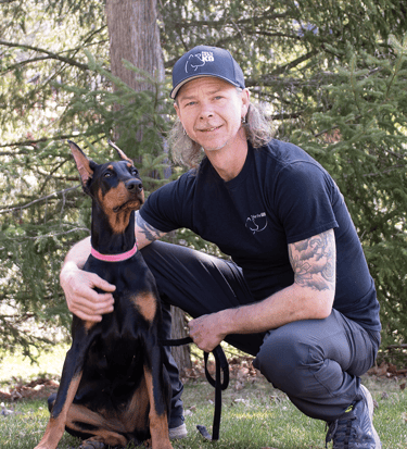 Professional Dog Trainer Guy Drinkwalter and his doberman Vixen