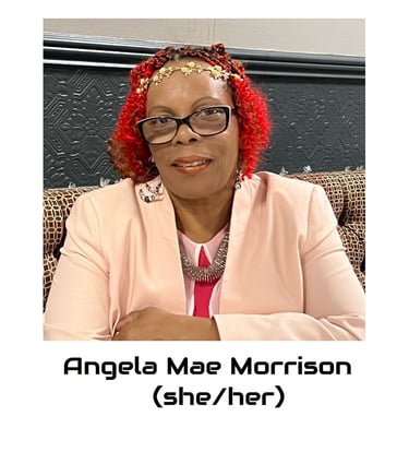 Angela is a black mid fat woman, her hair is red and she is wearing glasses. 