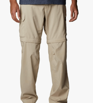 a man in a blue shirt and tan pants