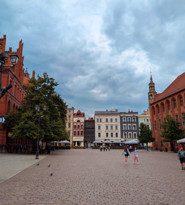 Medieval old town square in Toruń with red-brick buildings