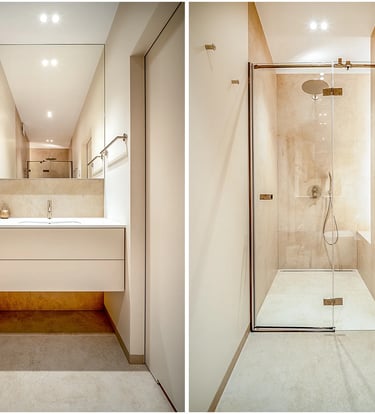 Nowoczesna łazienka: po lewej umywalka z szafką i lustrem, po prawej przeszklona kabina prysznicowa.