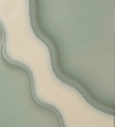 A close-up photograph of a finished resin panel with intricate pristine cream and muted sage green textures, emphasizing the smooth, glossy finish.