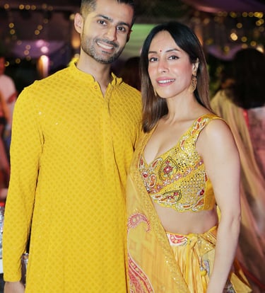 a man and woman in yellow clothes standing next to each other