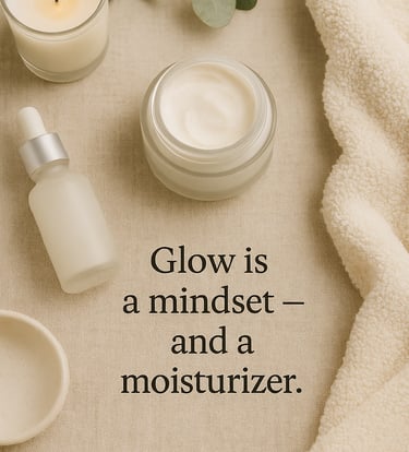 Flat lay of a glass moisturizer jar, dropper serum, eucalyptus sprig, and candle on a neutral beige