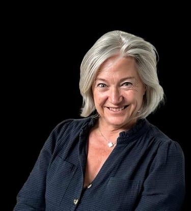 This is an image of Cecile Molinas smiling on a black background