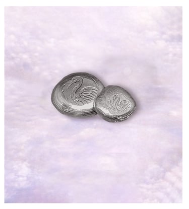 Handcrafted pure silver nugget with a crane logo in smooth finish