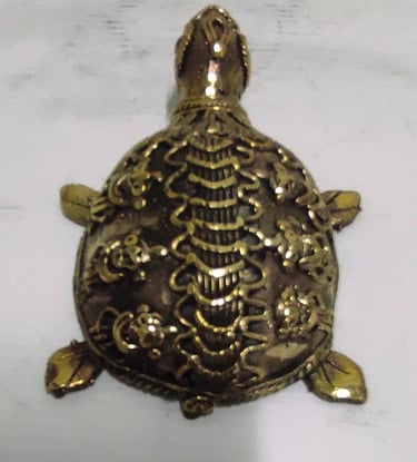 "Handcrafted brass turtle with engraved floral design–Vastu and home decor piece-Prepared for export"