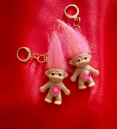 Gold huggie-hoops with pink troll dolls