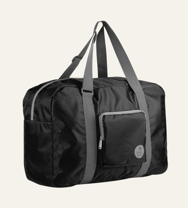Black foldable travel duffel bag with grey shoulder straps and front zipper pocket for carry-on luggage.