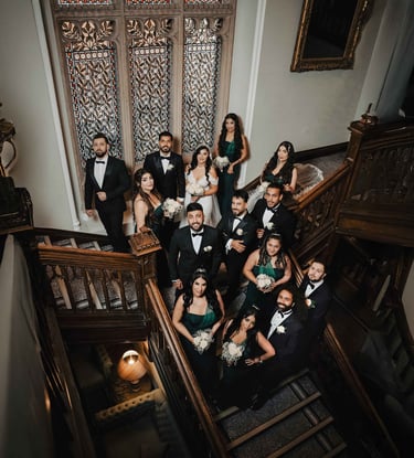 Wedding party on grand staircase, shot by Fred Art Studio
