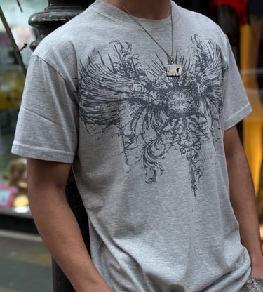 a man in a gray shirt and a white shirt