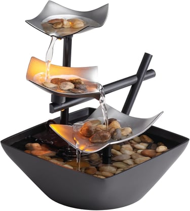 Indoor tabletop water fountain with cascading water, natural river rocks and LED lights for calming home or office decor