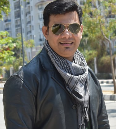 a man in a black jacket and sunglasses, raheel ahmed