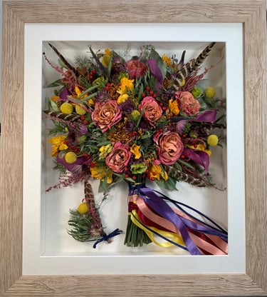 a side view preserved wedding bouquet with bright ribbons