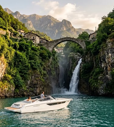 Private luxury boat approaching Orrido di Nesso waterfall beneath stone bridge on Lake Como Italy