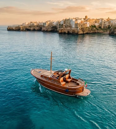 Handcrafted Fratelli Aprea boat on turquoise Adriatic Sea near Polignano a Mare at golden hour