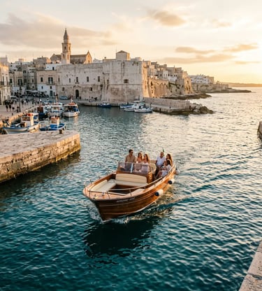 Wooden private boat with guests leaving Monopoli old town harbor at golden hour sunset in Puglia