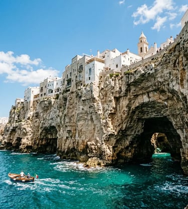 Dramatic Polignano a Mare cliffs with sea caves and boat on turquoise Adriatic water